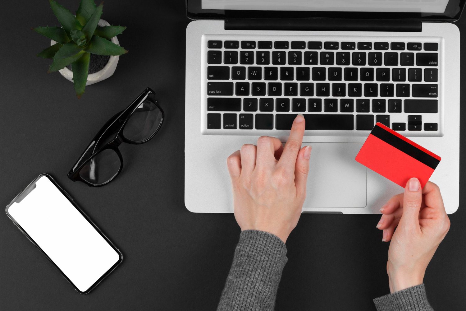 A person reviewing online insurance options on a laptop with security icons in the background.